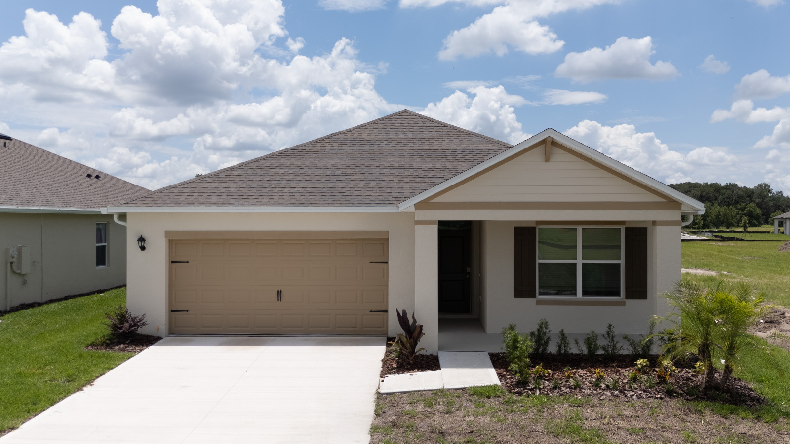 Exterior single family home with two car garage