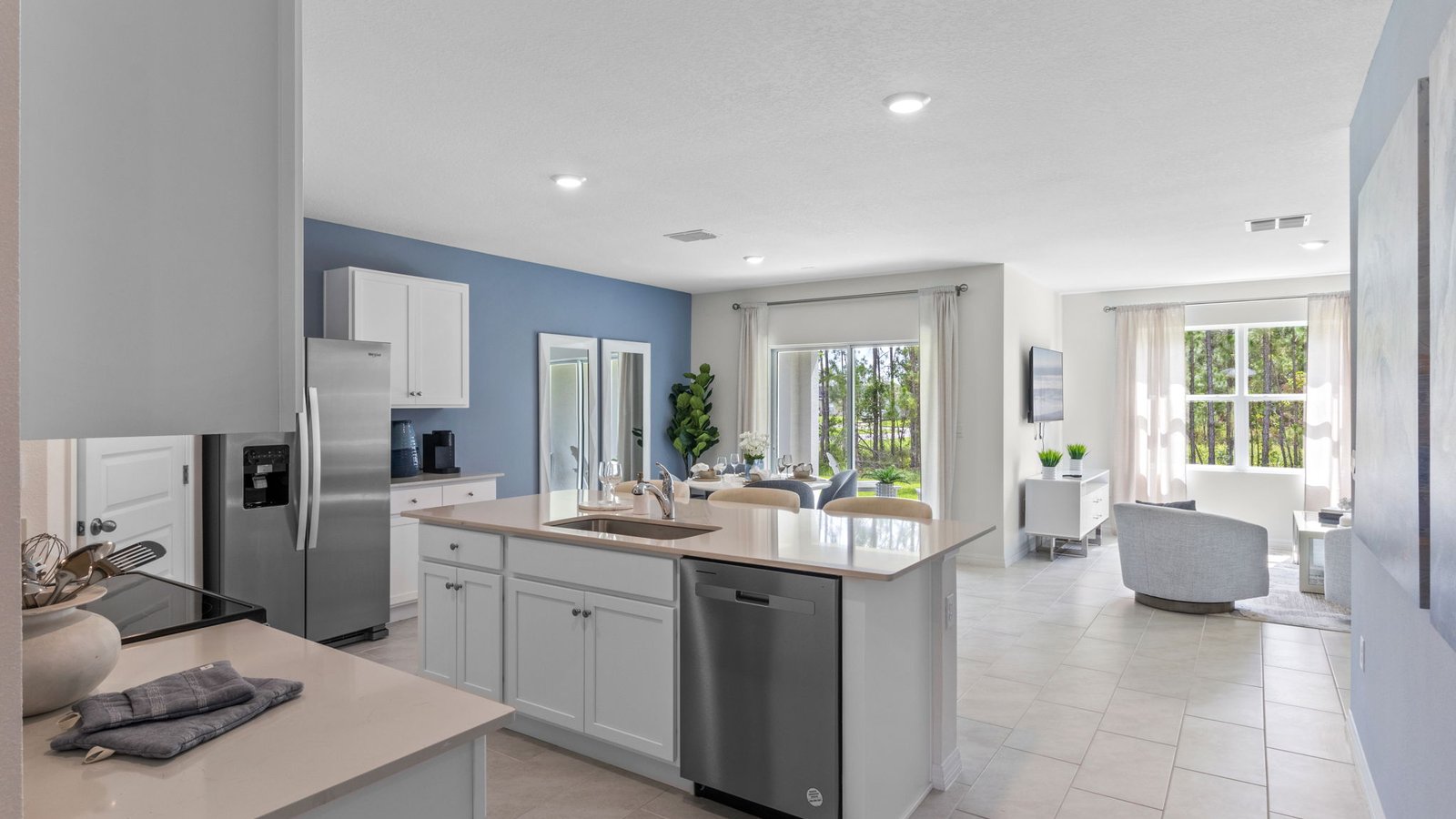Open kitchen area with stainless-steel appliances