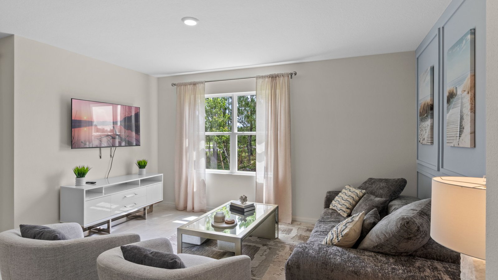 Living room with window facing the backyard