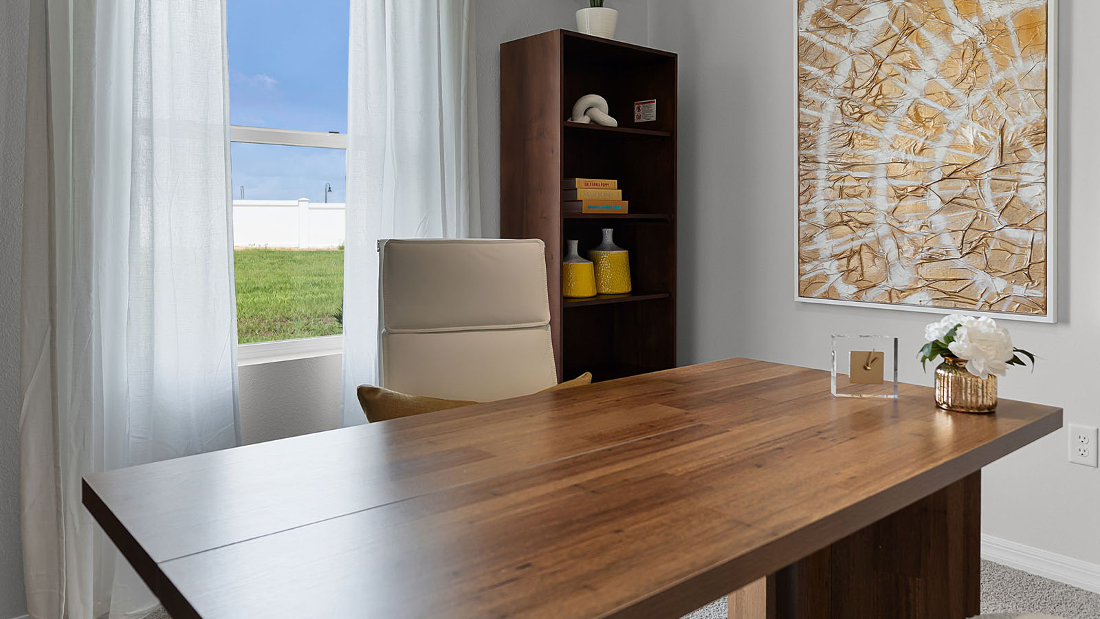 guest bedroom decorated into an office space