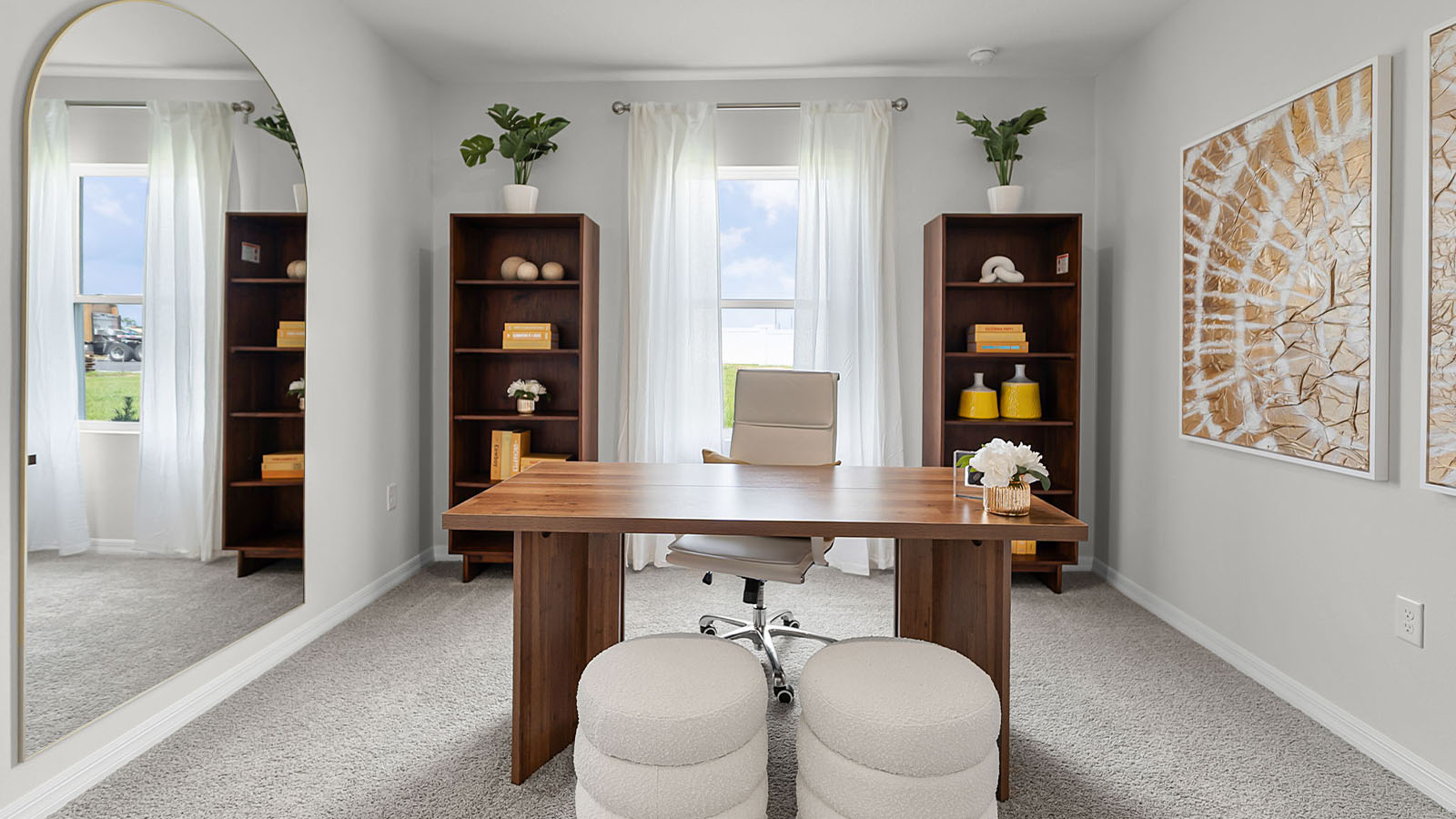 guest bedroom decorated into an office space