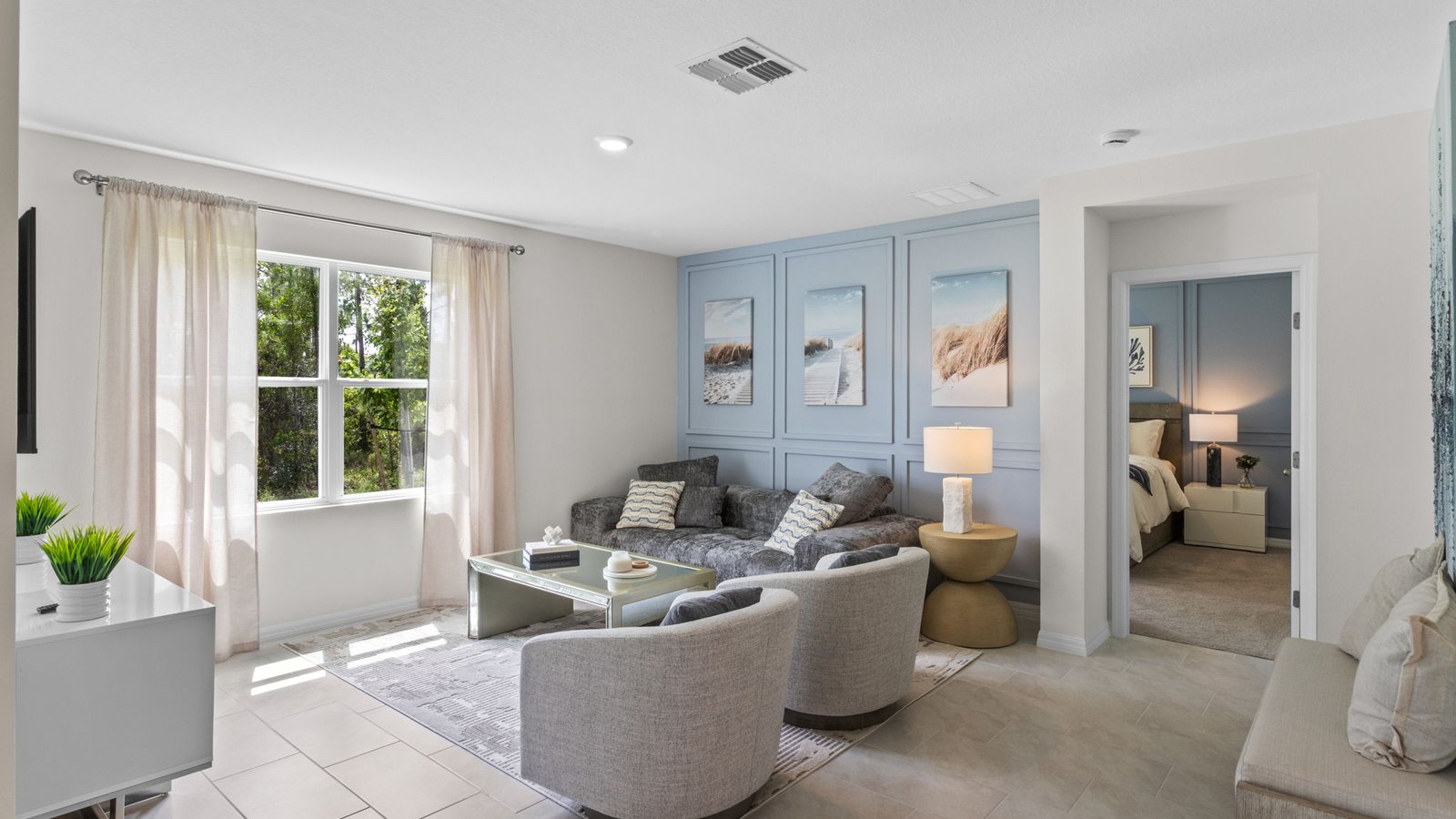 Living room with window facing the backyard