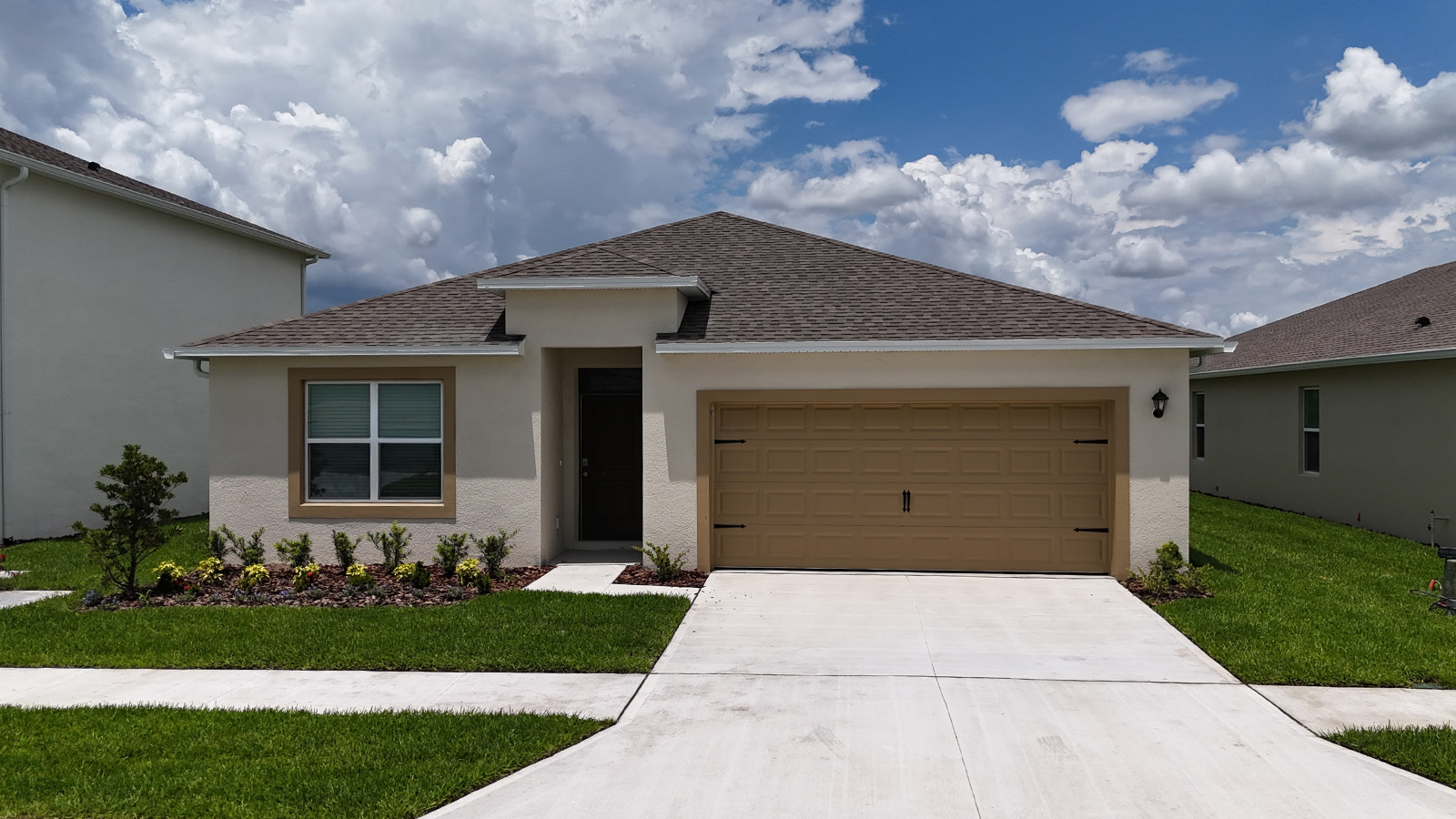 Exterior single family home with two car garage