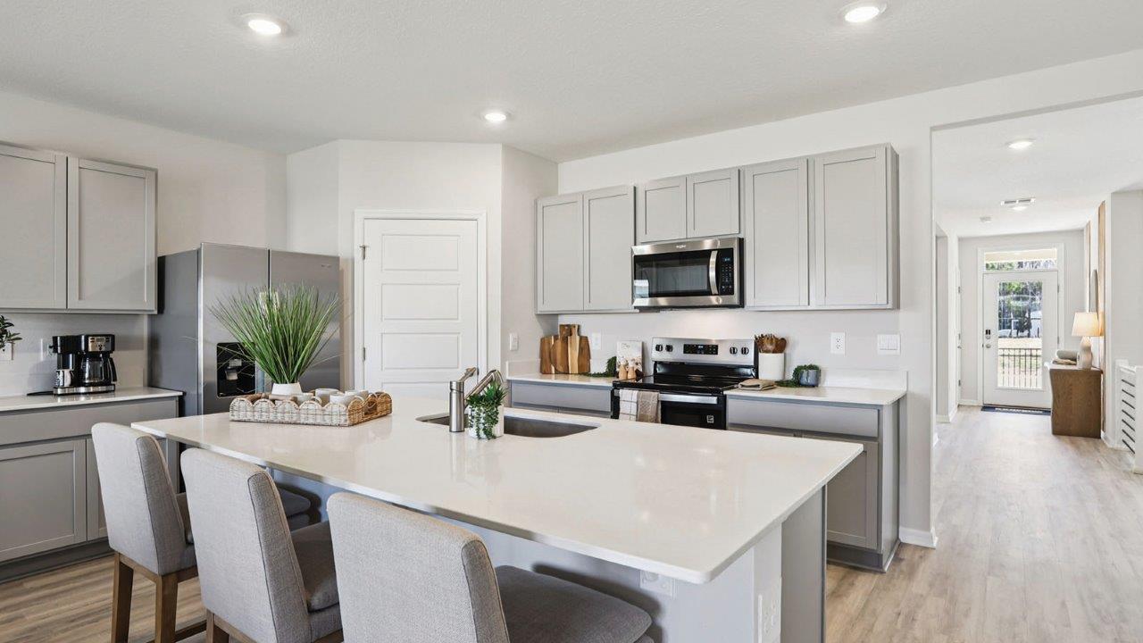 kitchen with large island and bar stools