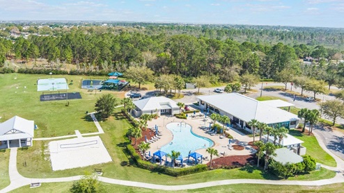 aerial view of the community center, pool, park, volleyball, swings and basketball