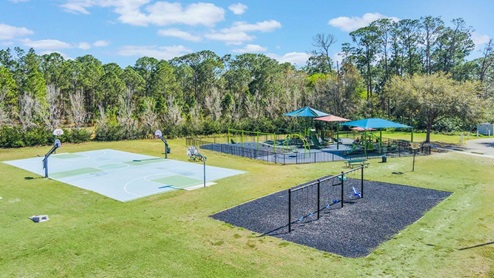 aerial view of the community center, pool, park, volleyball, swings and basketball