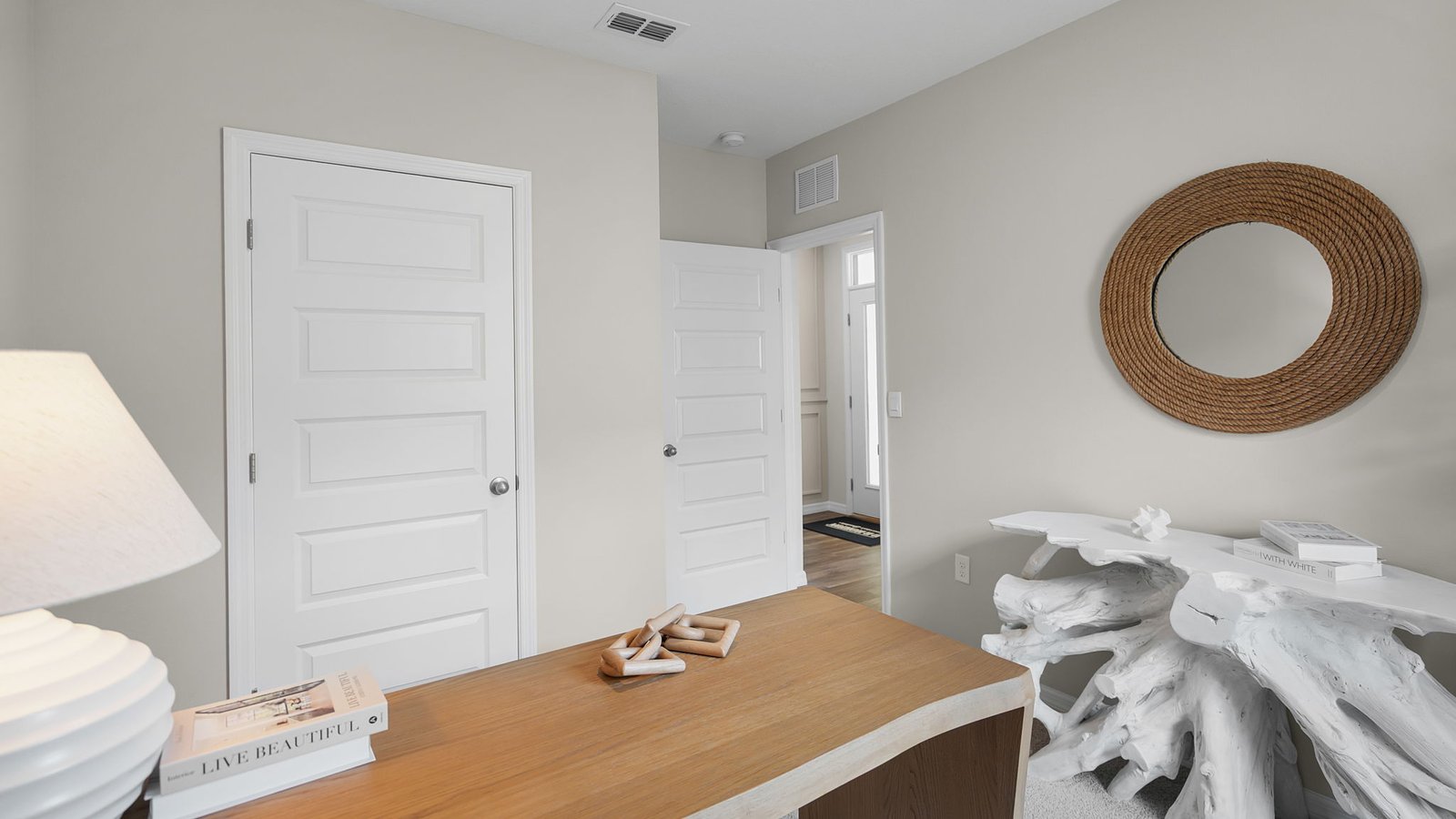 large desk in office with decor