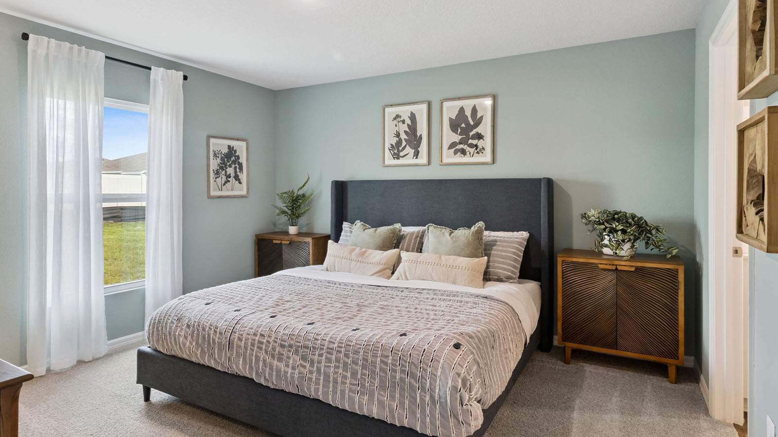 Primary bedroom with carpet flooring