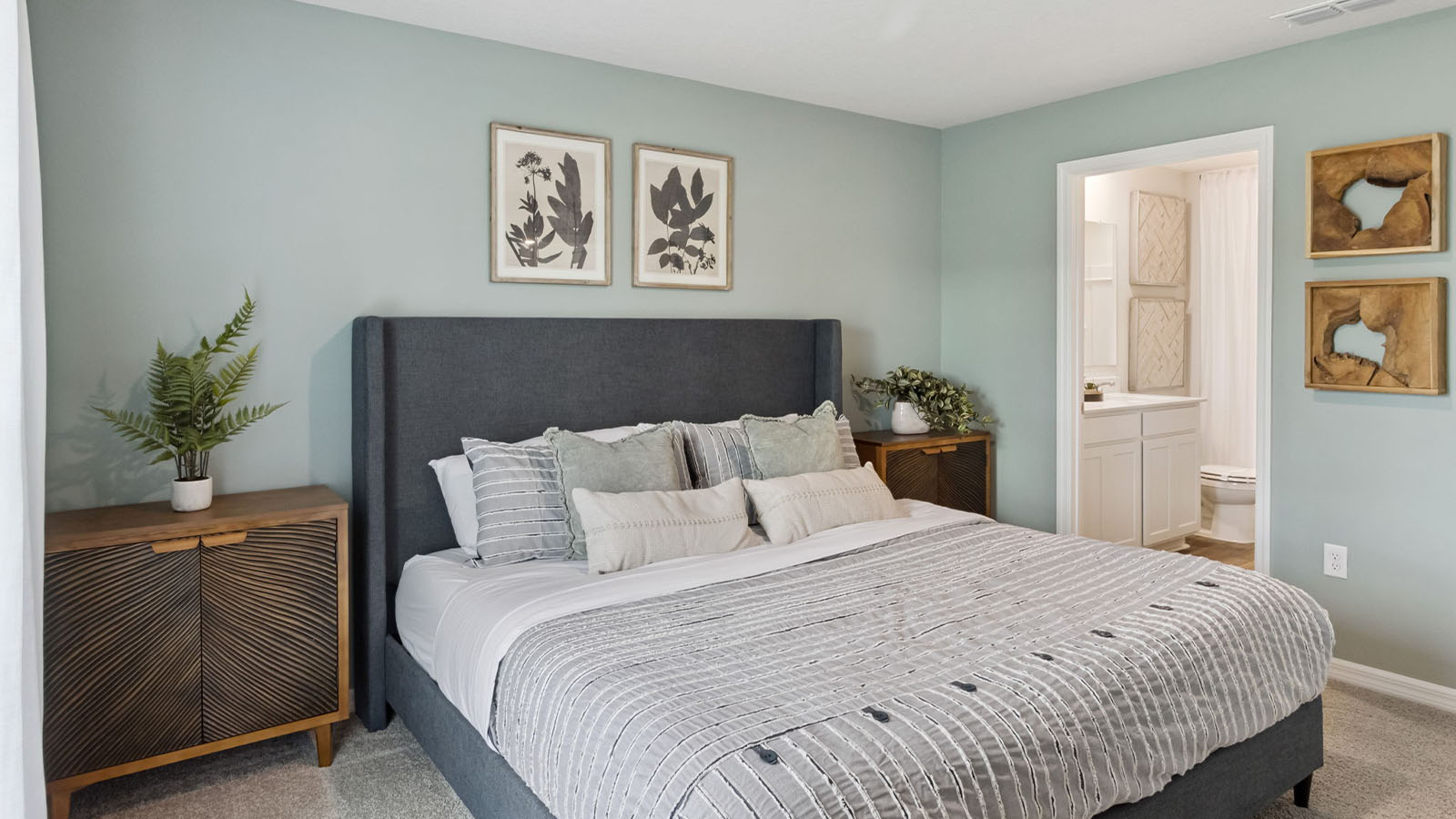 Primary bedroom with carpet flooring