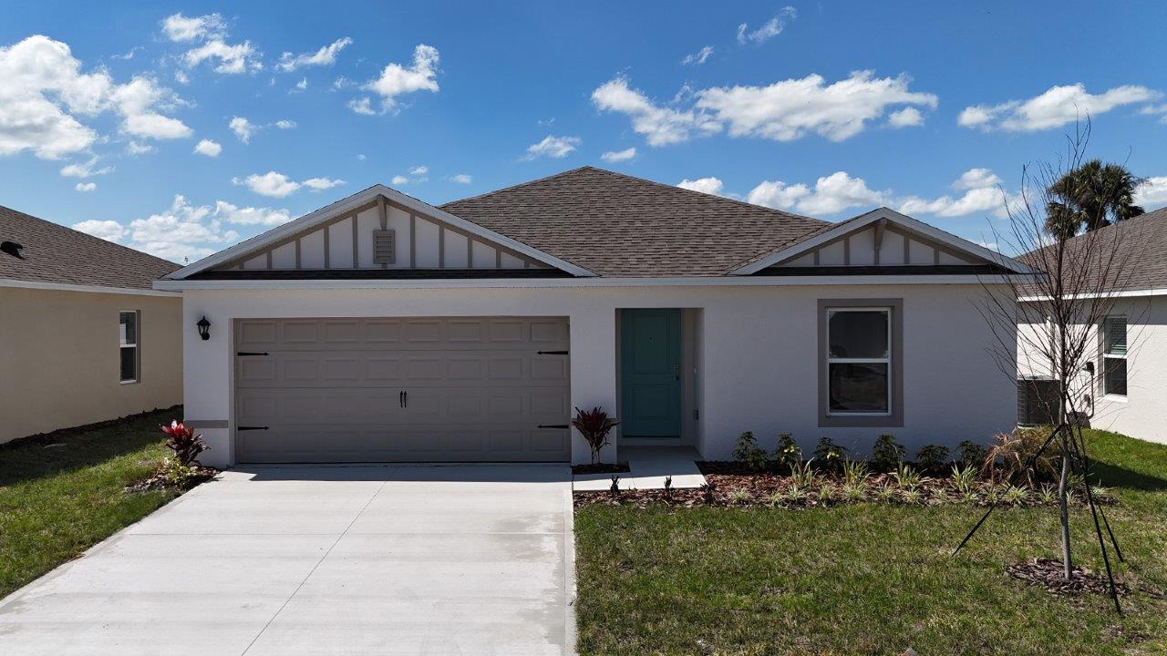 Exterior single family home with two car garage
