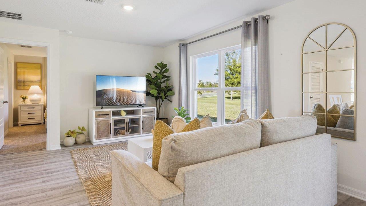 Living Room with view into the Primary Bedroom