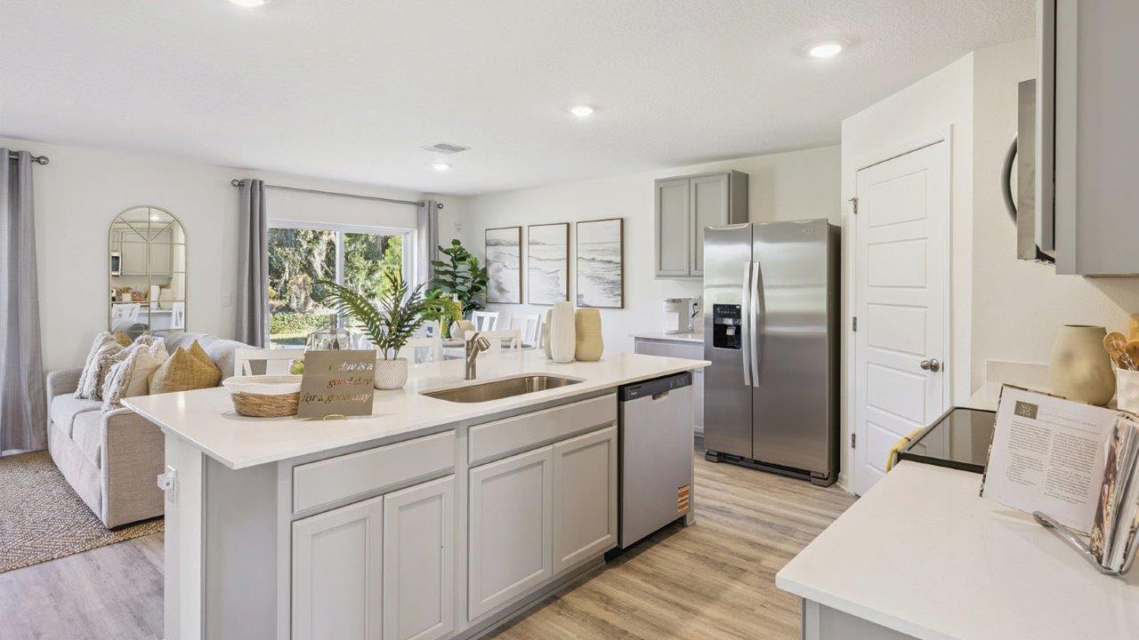 Kitchen island overlooking living room and dining room