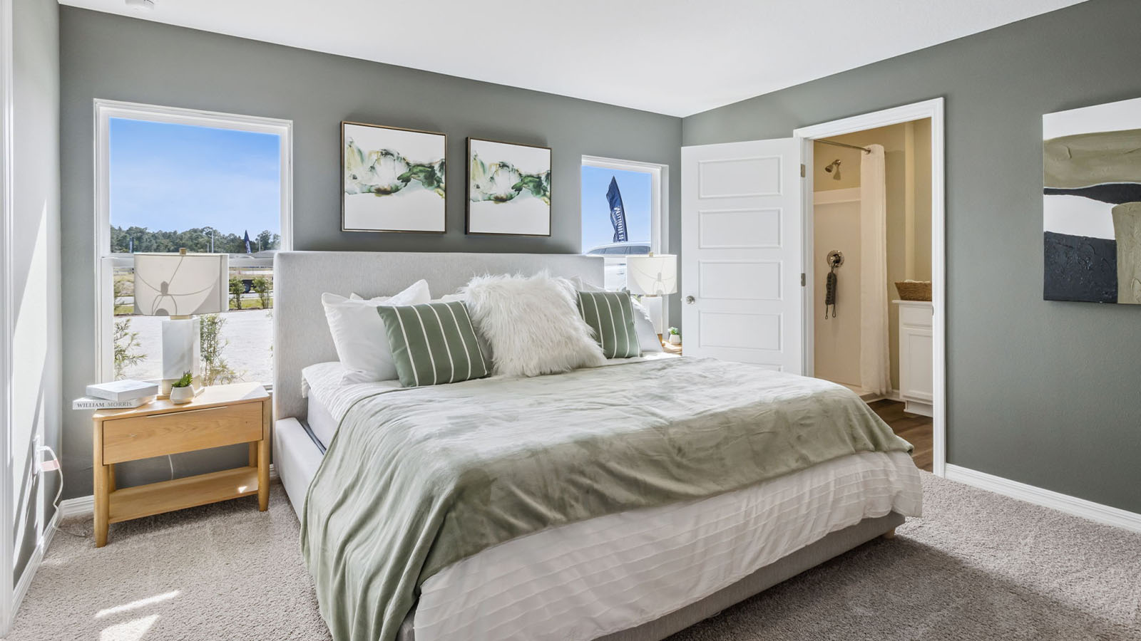 Primary bedroom with carpet flooring