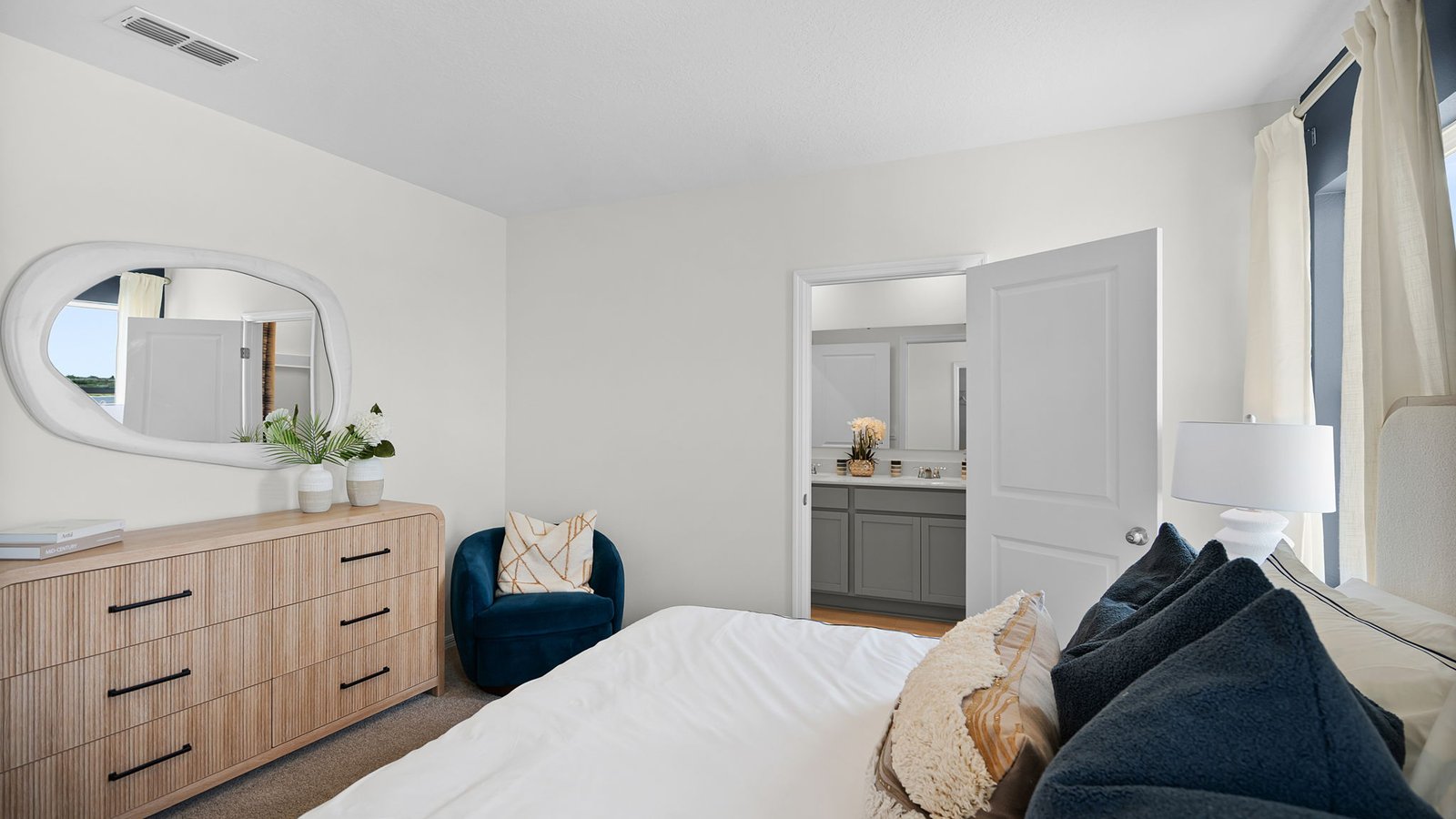 Primary bedroom with attached bathroom