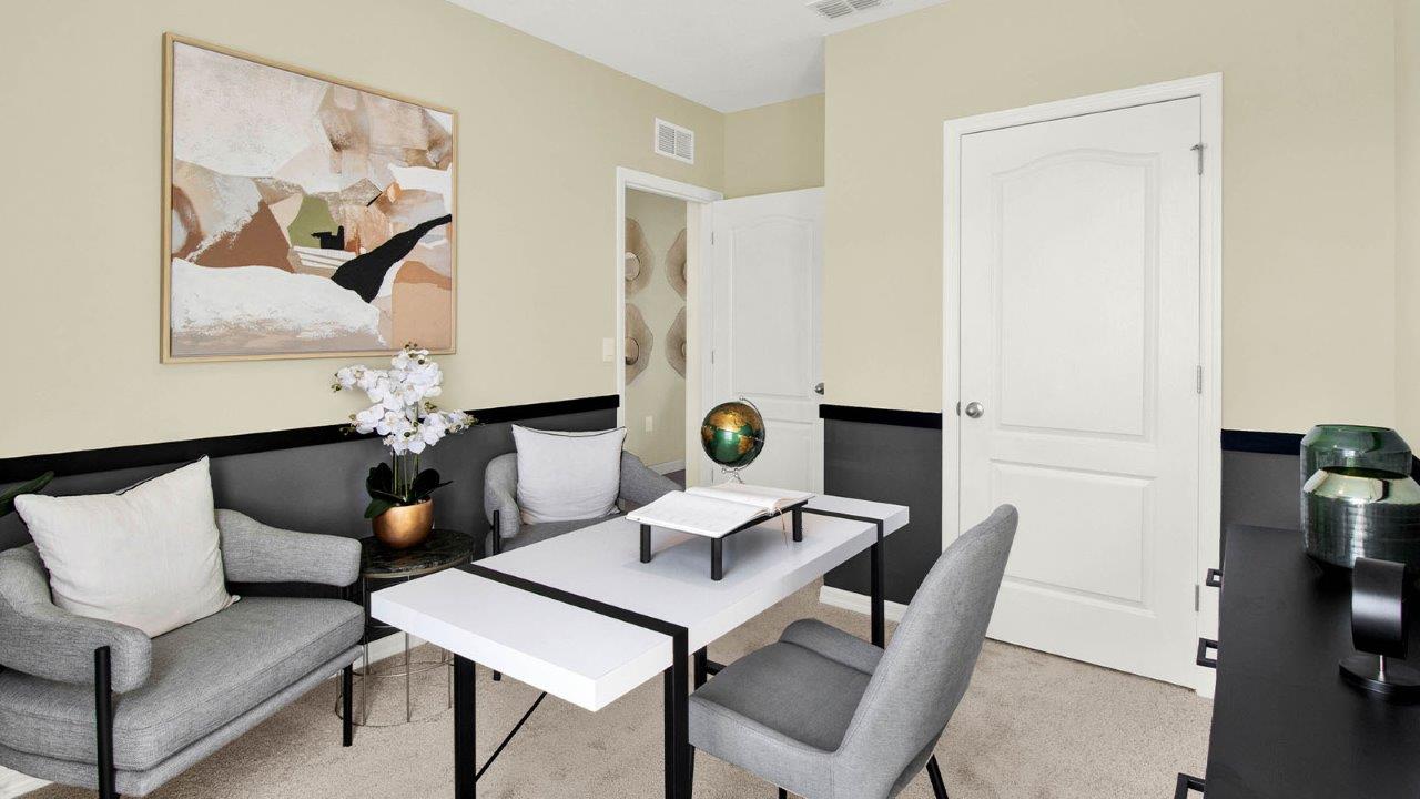 guest bedroom decorated as an office space