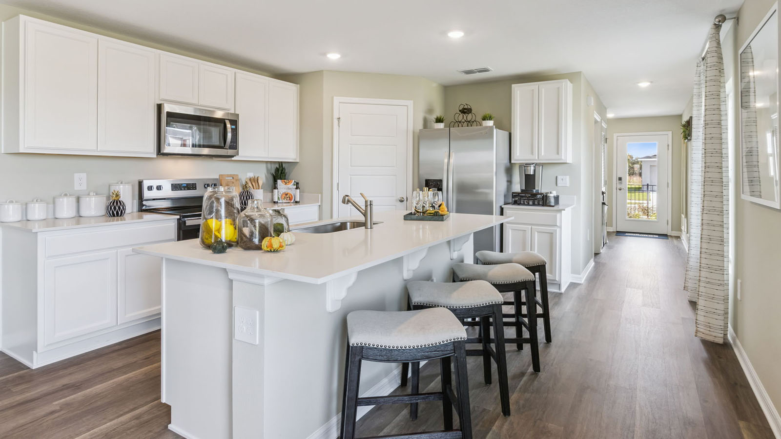 Kitchen island with granite counter-tops and stainless steel appliances