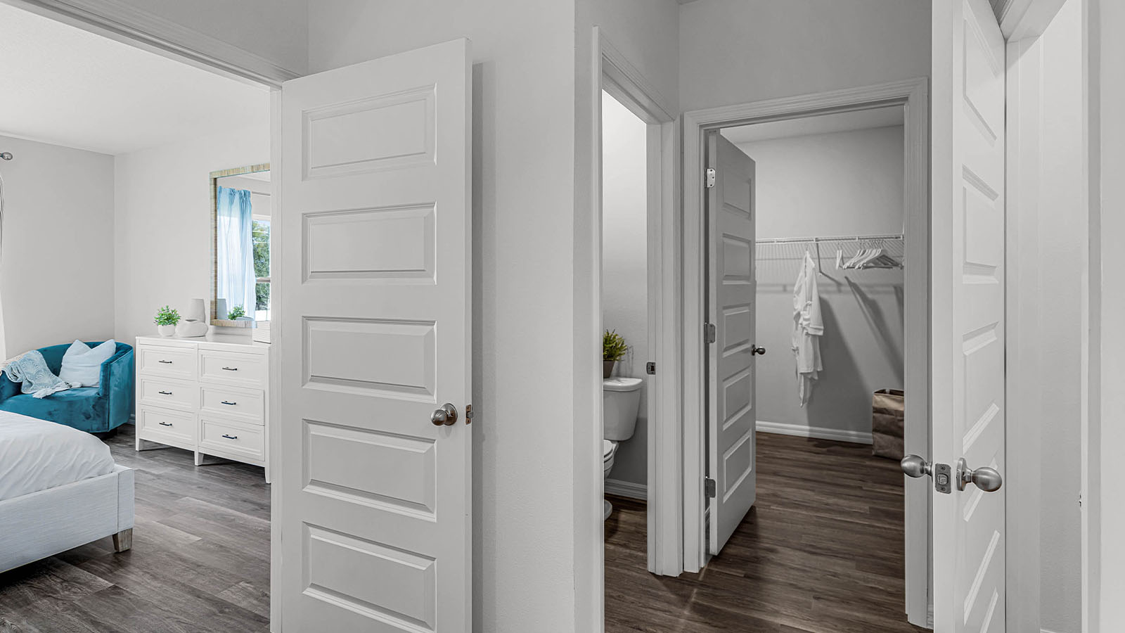 Walk in closet next to the private entrance to the toliet