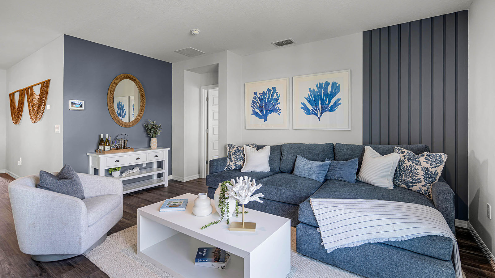 Living room with couch on the left and TV on the right