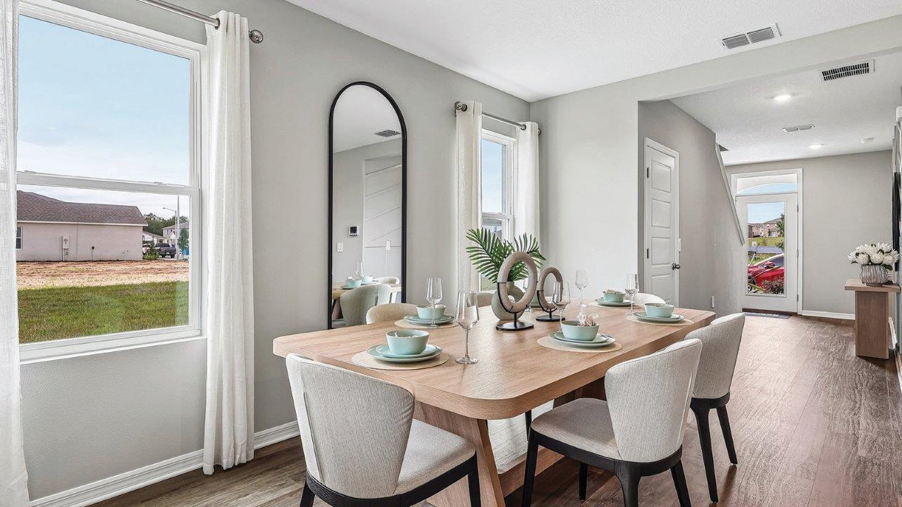 Dining room table with windows for natural light