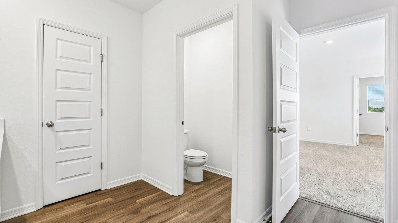 Primary bathroom with private toilet room
