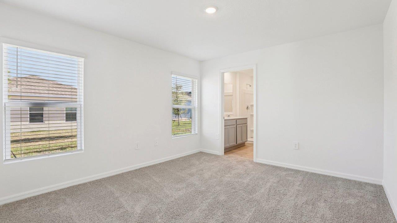 Primary bedroom with windows