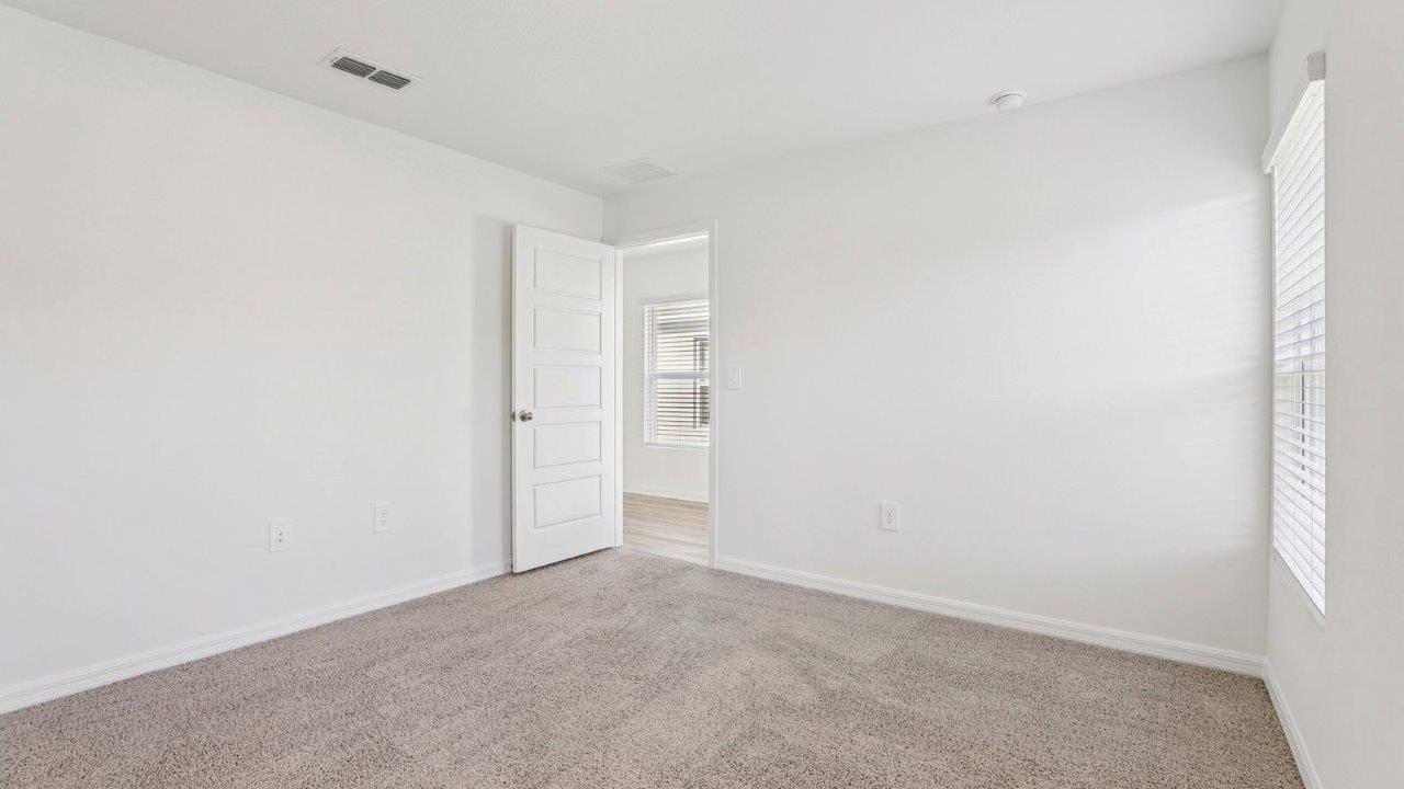 Primary bedroom with view of door