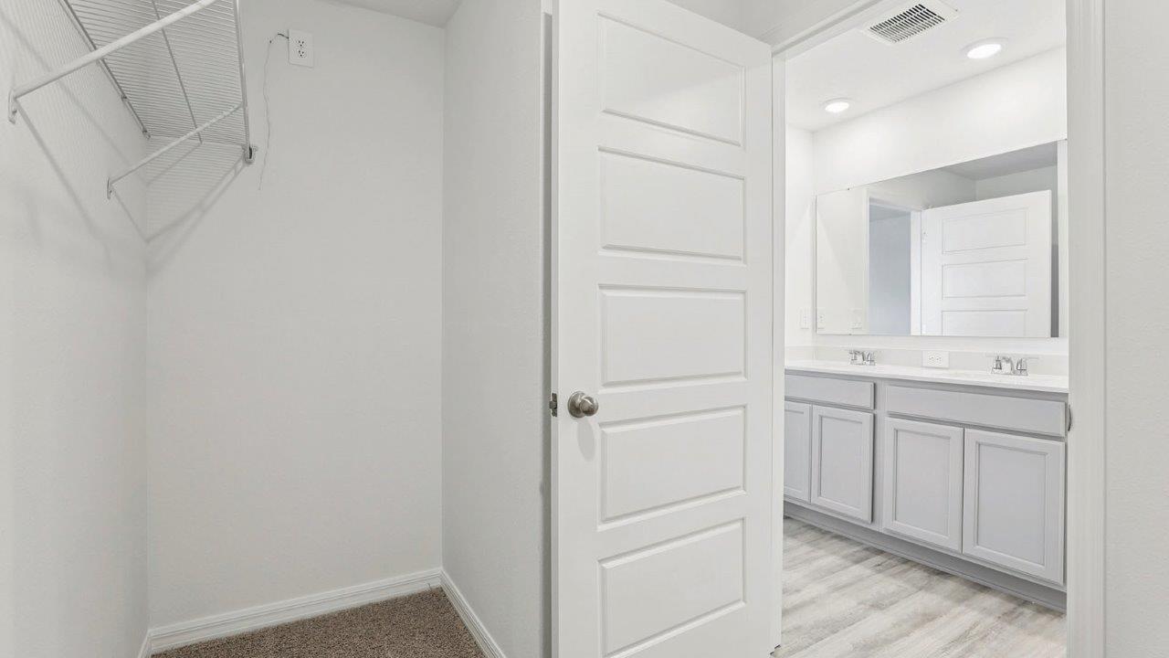 Primary closet and bathroom