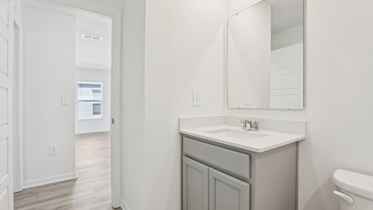 Guest bathroom showing single sink and mirror