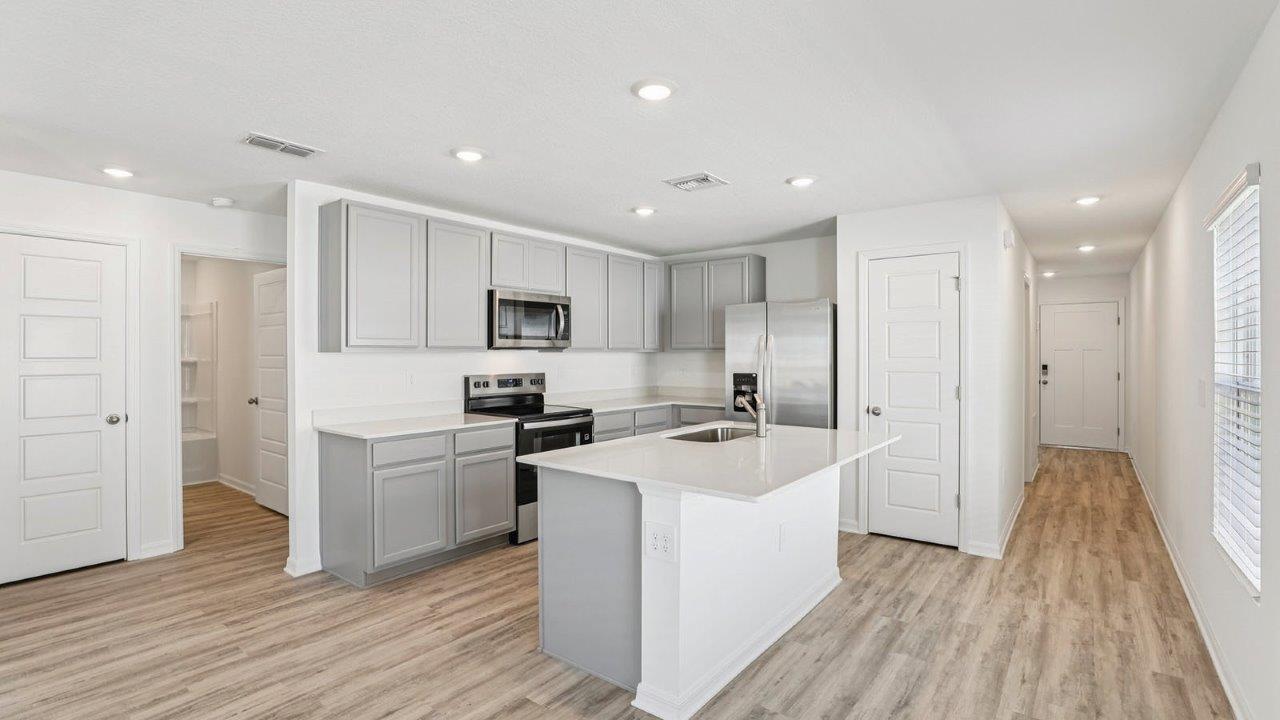 Kitchen with island and cabinets