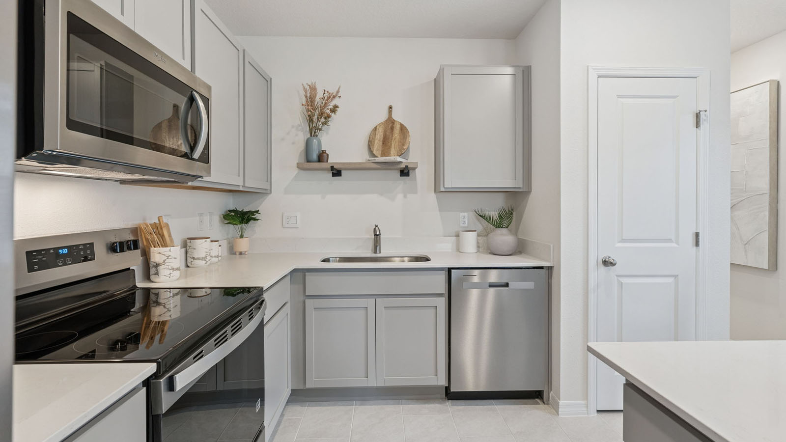 Kitchen with floating shelf and appliances