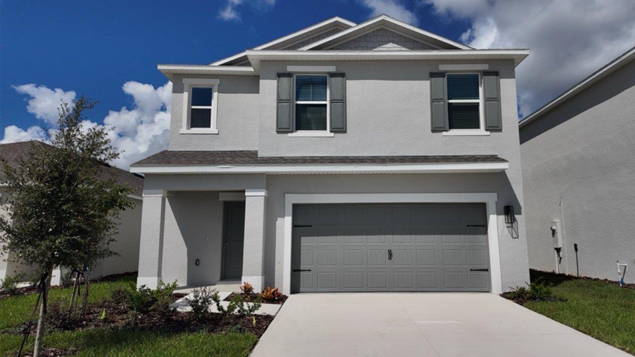 Exterior two story single family home with two car garage