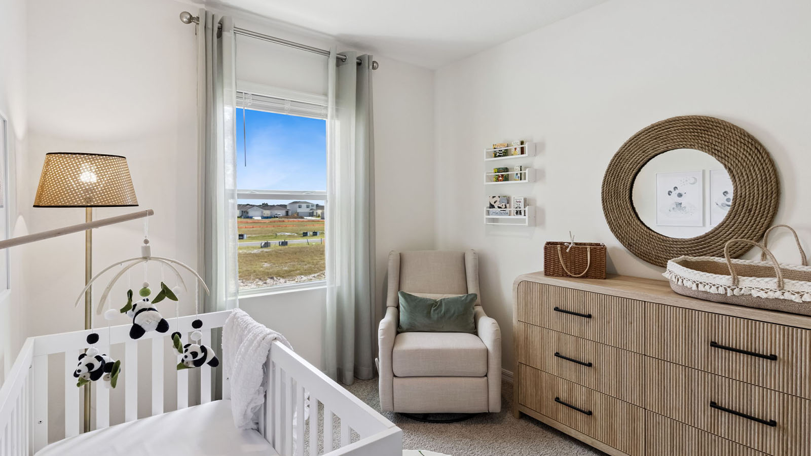 Bedroom staged as a Nursery with crib and dresser