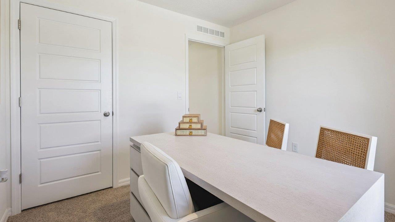 Office with desk and chairs