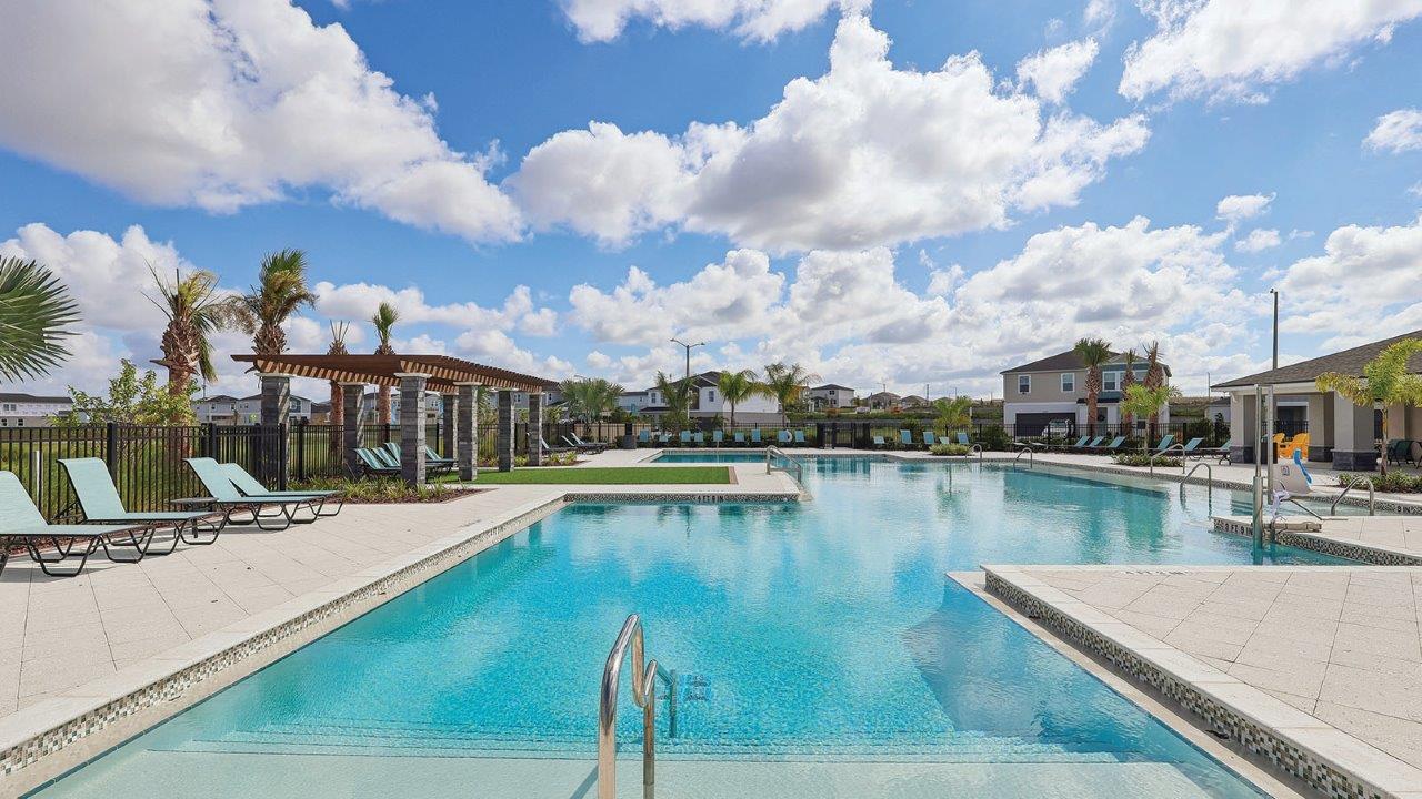 full size community pool with sun shelf