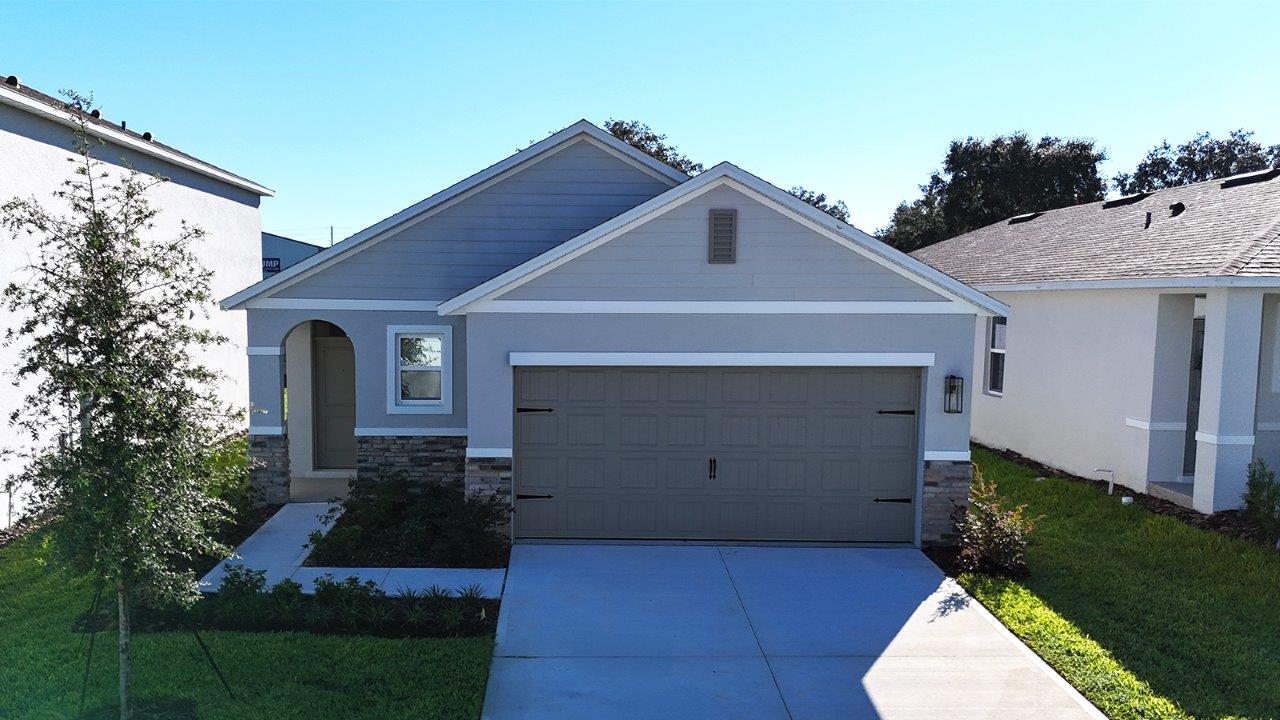 Exterior single family home with two car garage