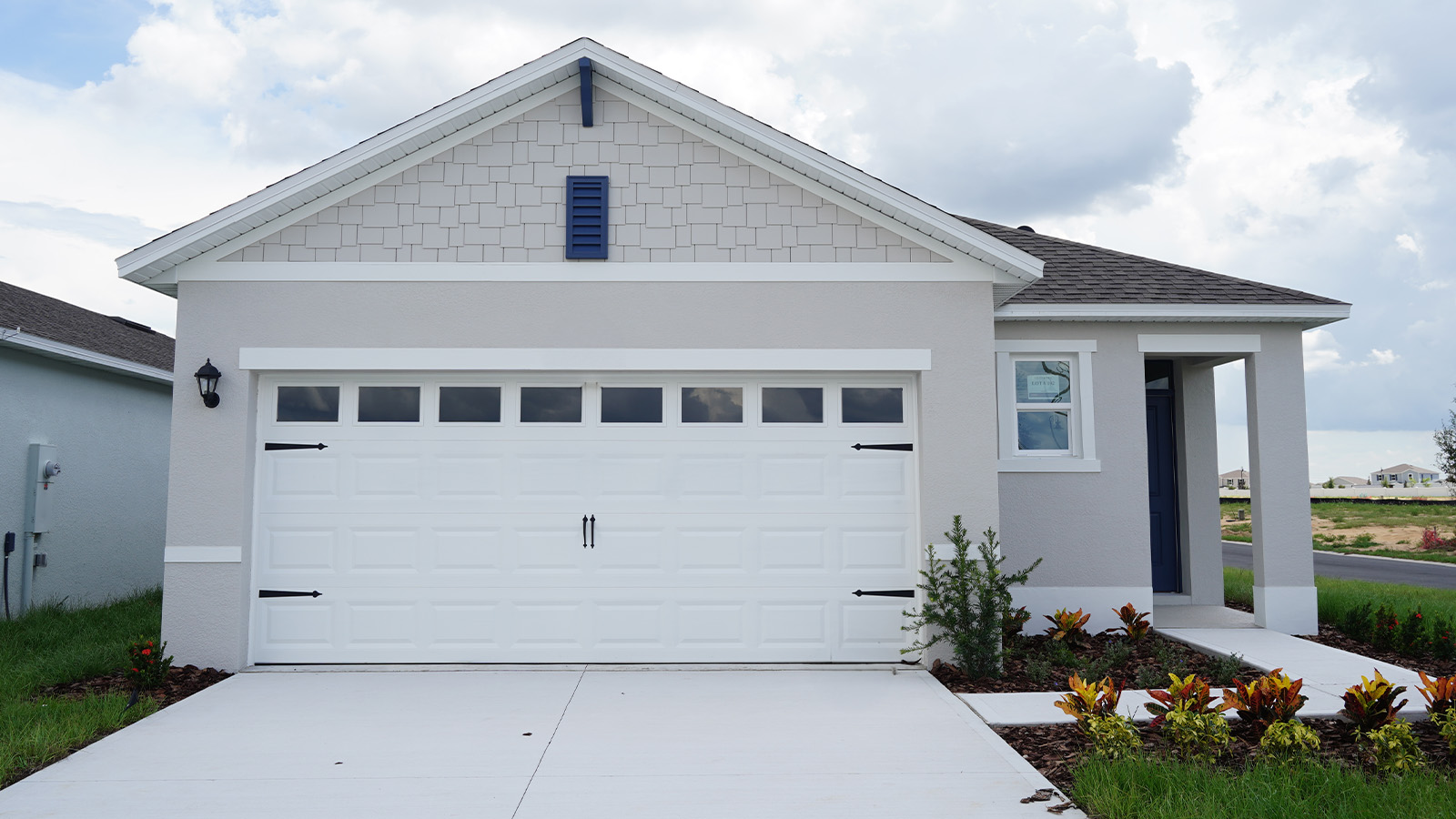 Exterior of a one-story home with pathway to the front door