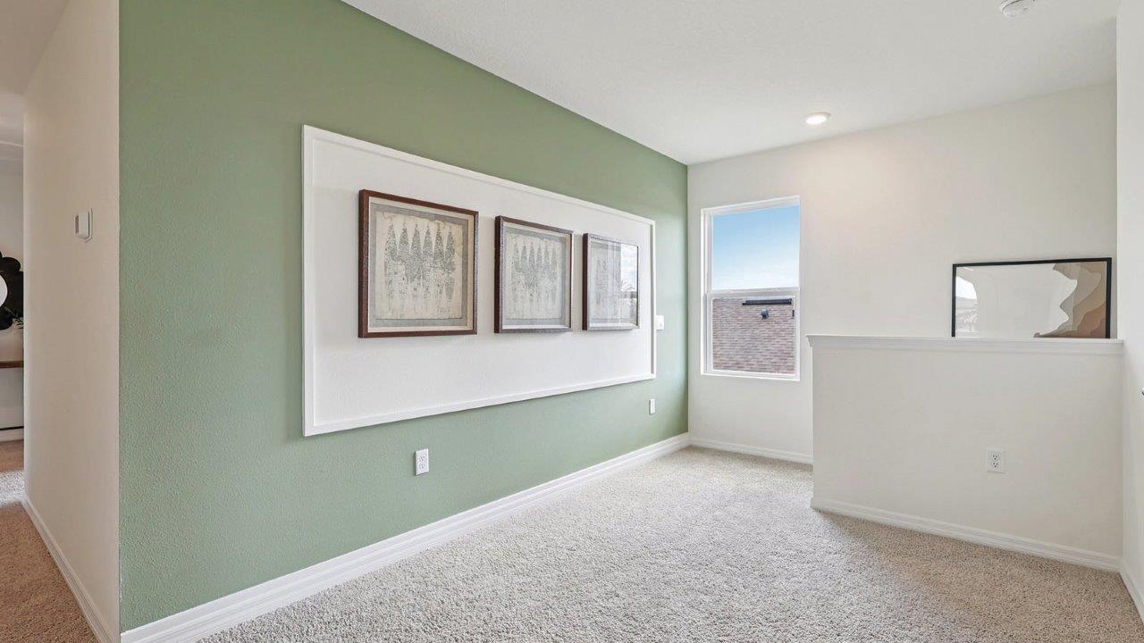 Upstairs loft area with wall art