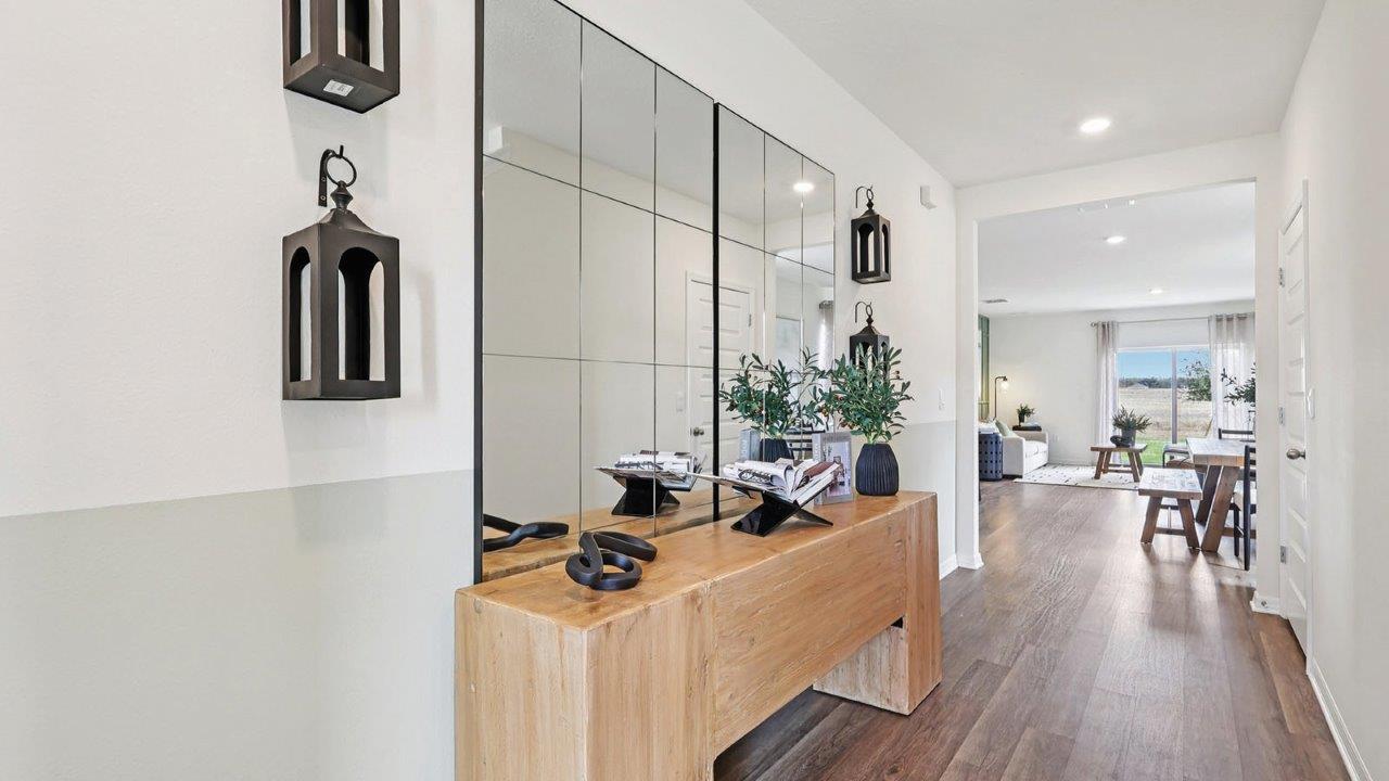Front entry hallway with big mirrors and table
