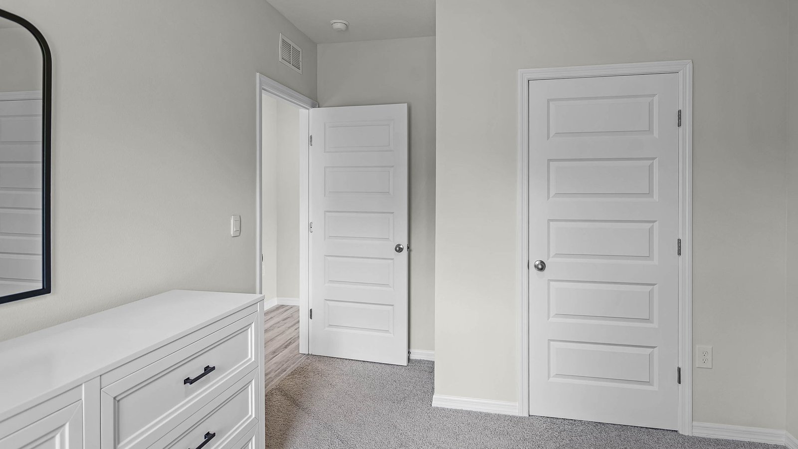 guest bedroom with a private closet