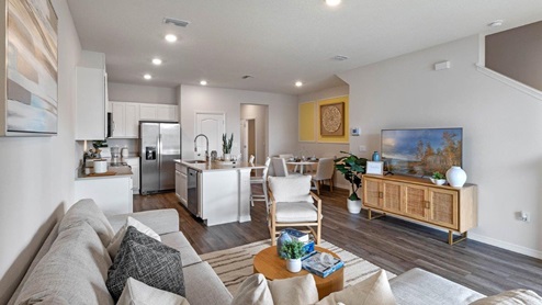 Living room with view of kitchen and dining room