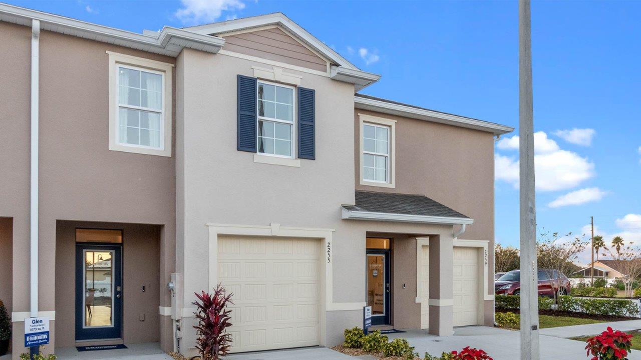 Exterior image of two story townhome and single car garage