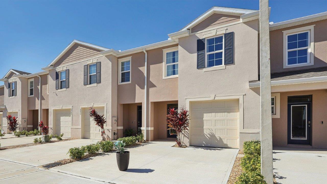 Exterior townhomes of glen model with beige color and two car driveways
