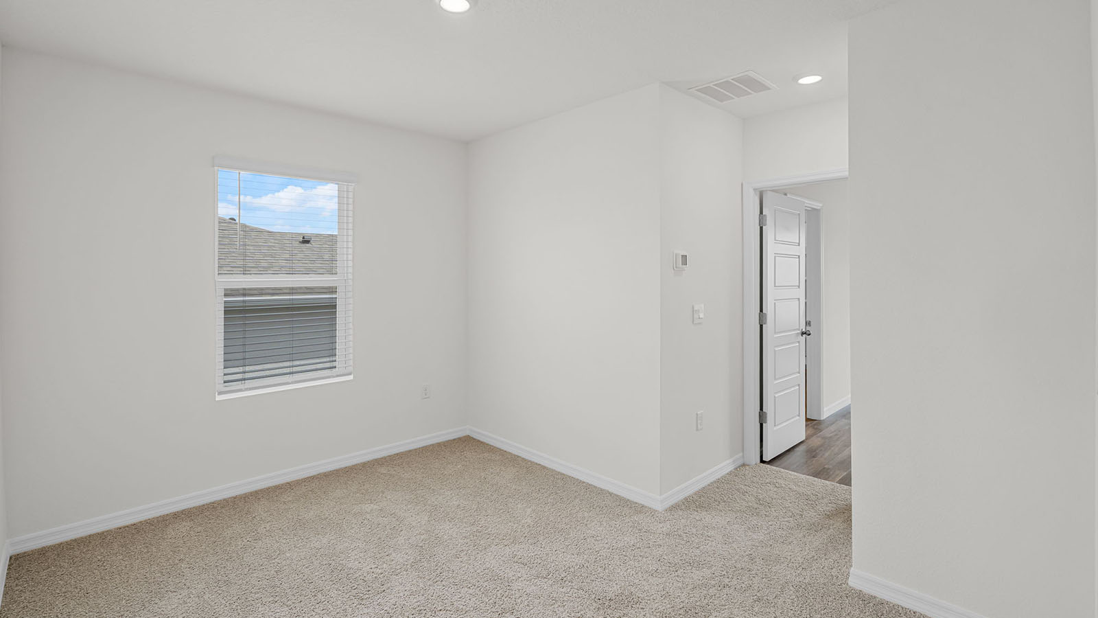 Guest bedroom with carpet
