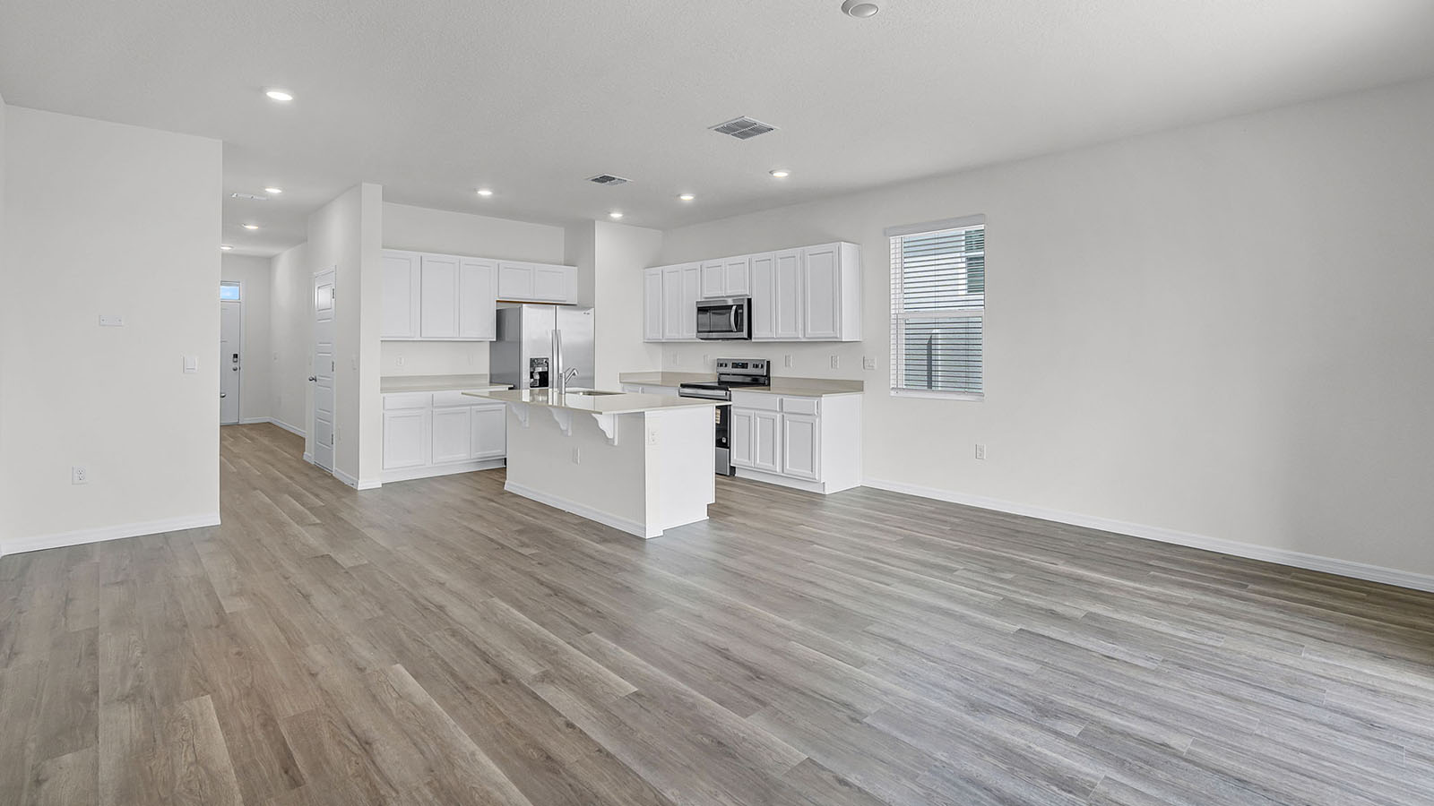 Living room with Luxury Vinyl Plank Flooring throughout