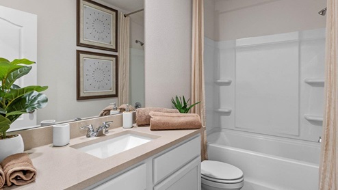 Upstairs guest bathroom with tub