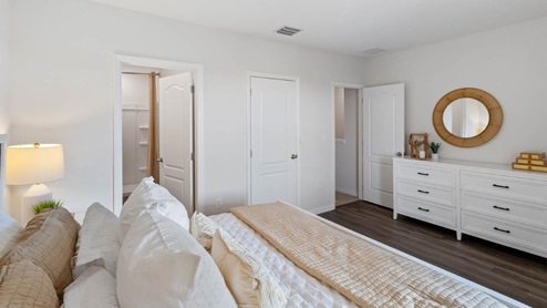 Primary bedroom with attached bathroom