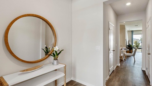 Entry Hallway with luxury vinyl plank floors and view to dining room