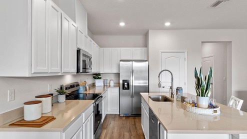 Kitchen view with kitchen island and stainless-steel appliances