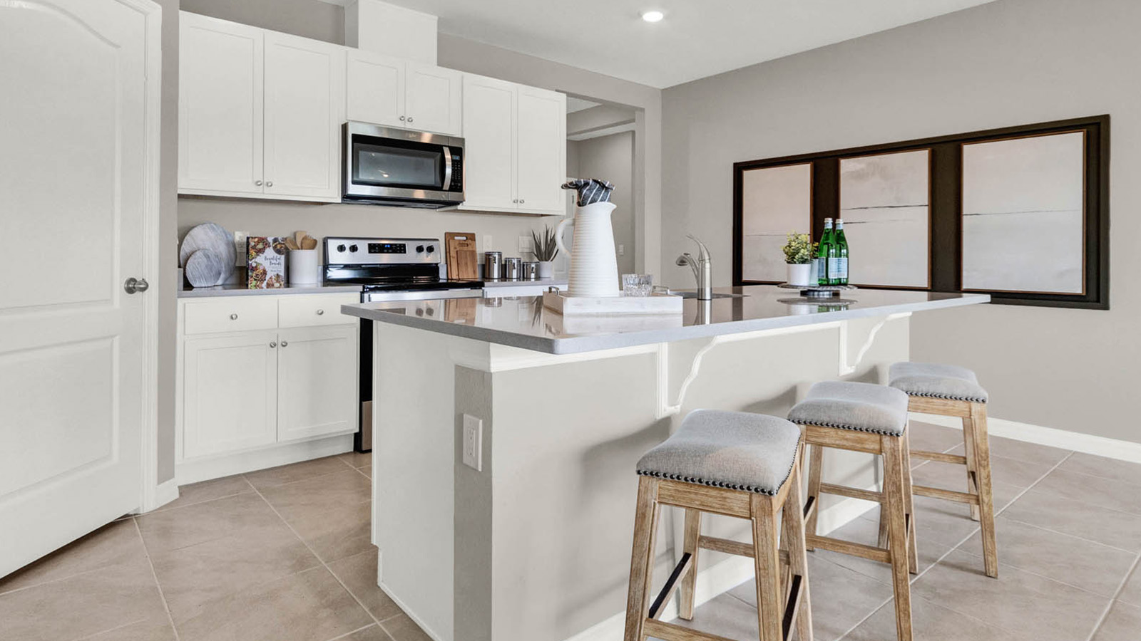 Kitchen with white cabinets and granite tops