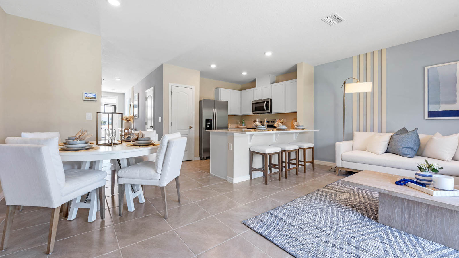 Living room and dining area overlooking the kitchen and entryway